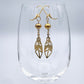 Boucles d'oreilles | Grandes plumes dorées